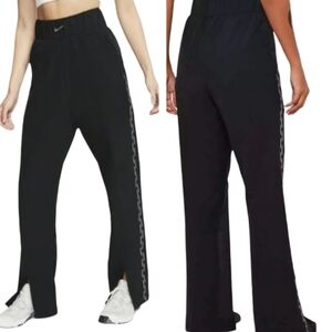 Nike Pro Women's Woven Pants in black, size medium. Loose fit